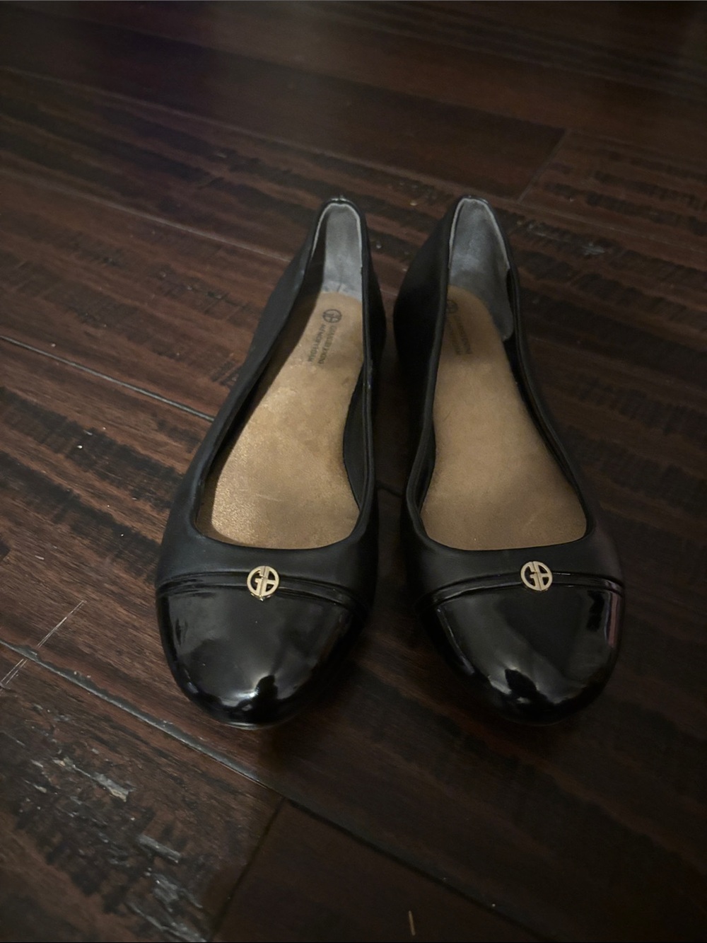 Giani Bernini Black Ballet Flats with Gold Logo Medallion